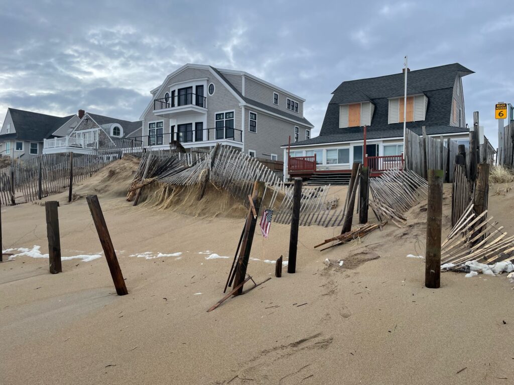 a beach with houses in the background (MyCoast AI)