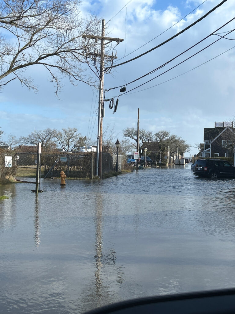 a flooded street with power lines (MyCoast AI)