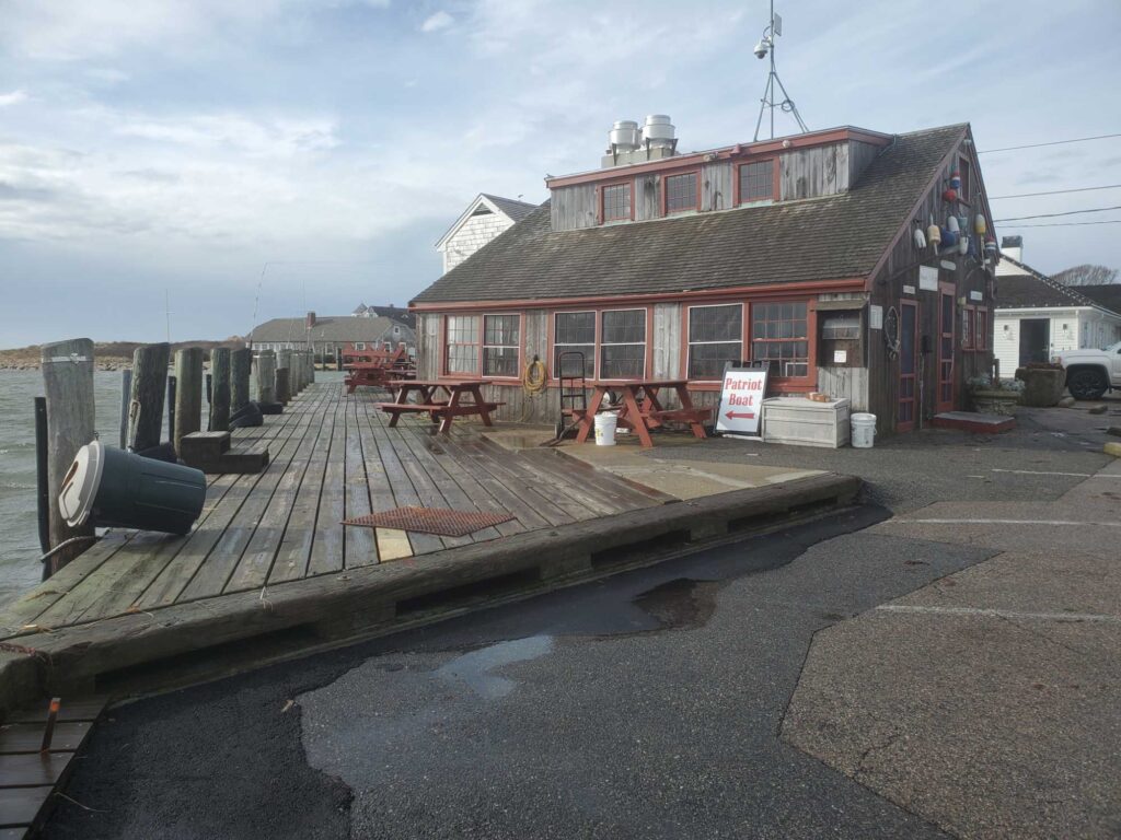 a boat docked in front of a building (MyCoast AI)