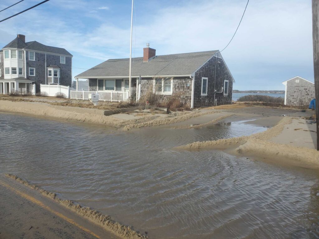 a flooded street with houses (MyCoast AI)