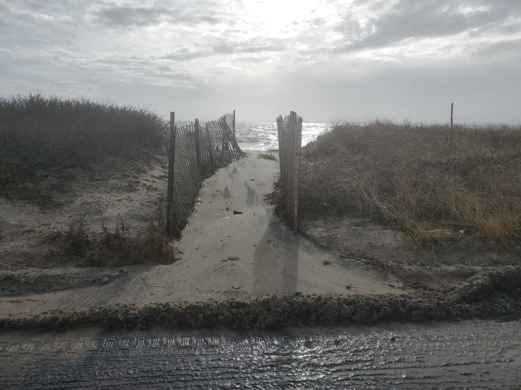 a road with a fence on the side (MyCoast AI)