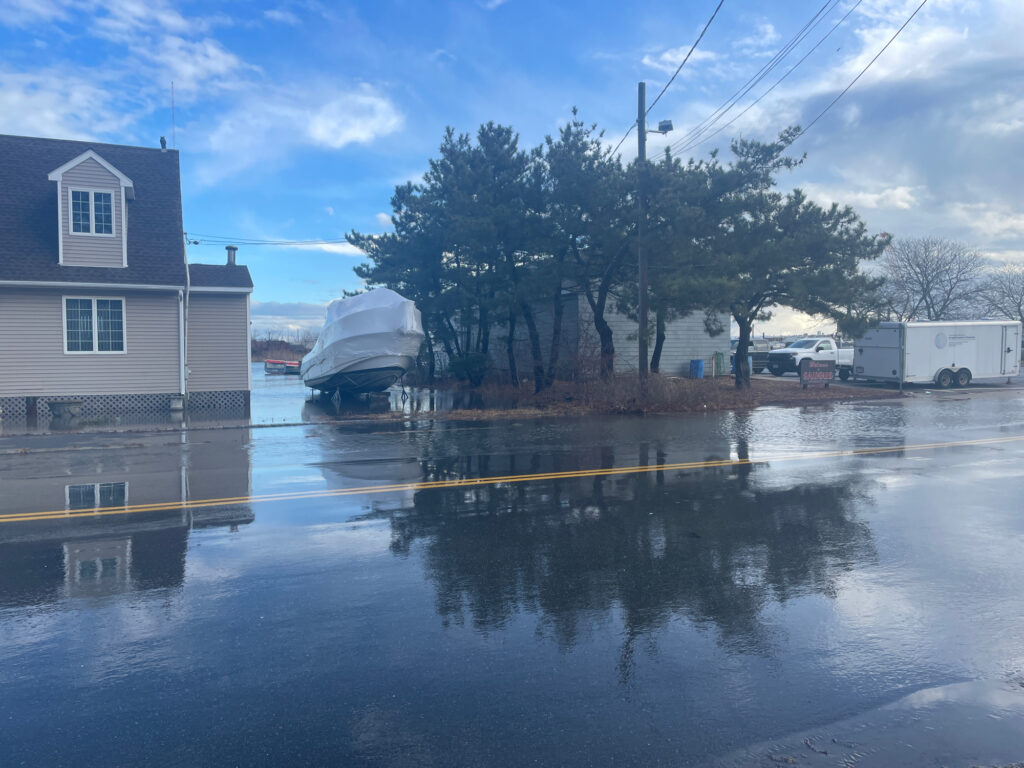 a flooded street with a boat (MyCoast AI)