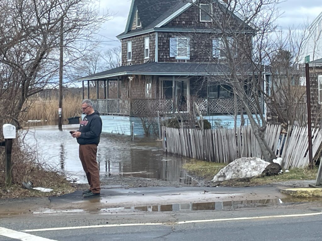 a man standing in a flooded street (MyCoast AI)