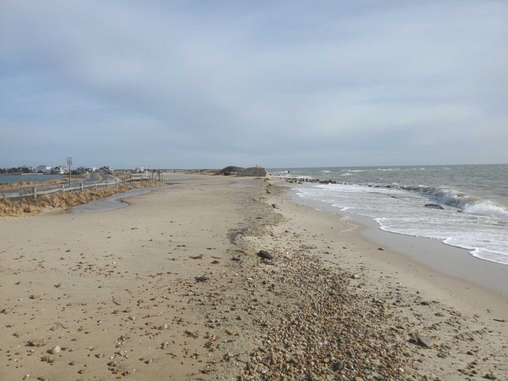 a sandy beach with waves crashing on it (MyCoast AI)
