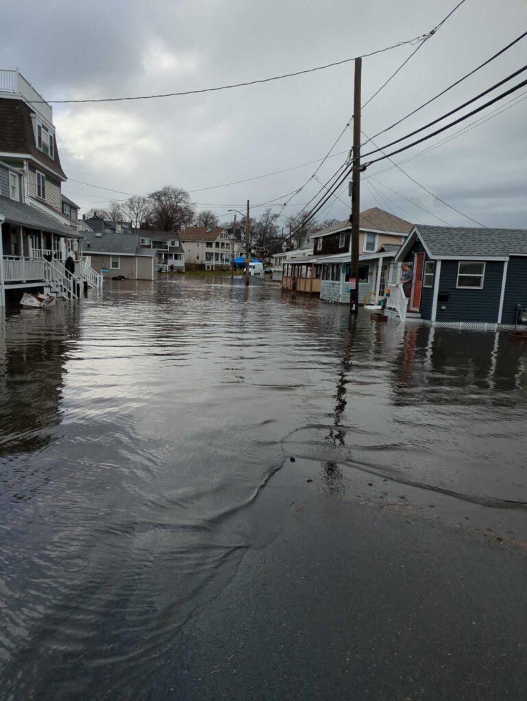 a flooded street with houses (MyCoast AI)