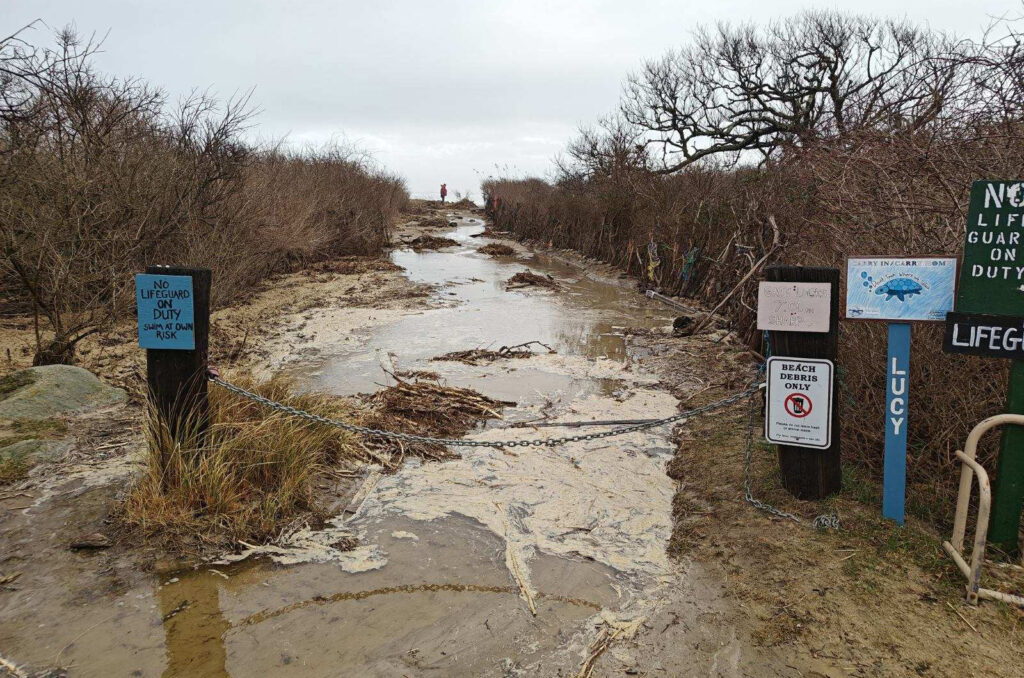 a muddy road with signs on the side (MyCoast AI)