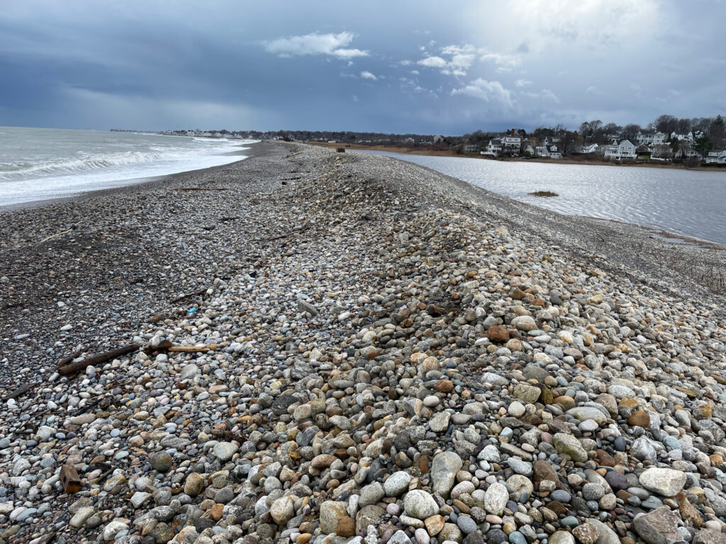 a rocky beach with a body of water in the background (MyCoast AI)