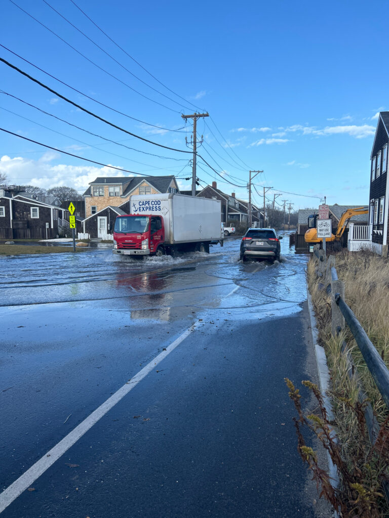 a truck driving down a wet road (MyCoast AI)