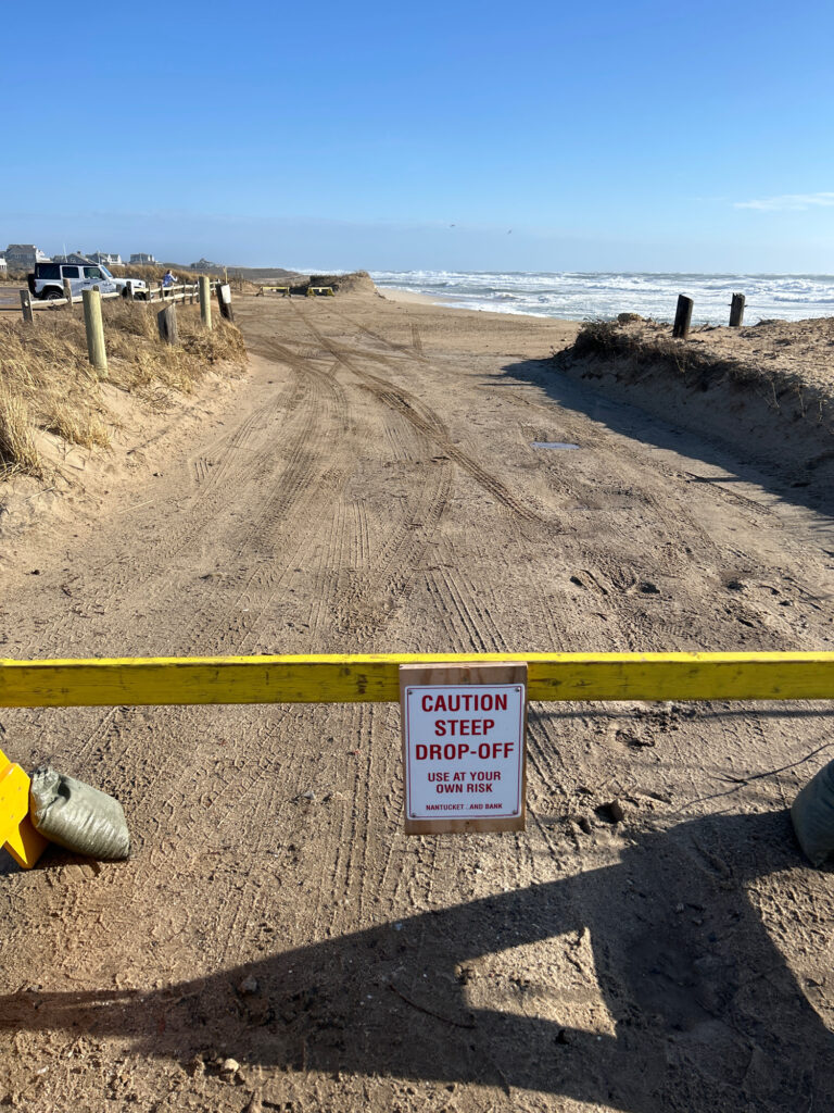 a yellow railing on a beach (MyCoast AI)