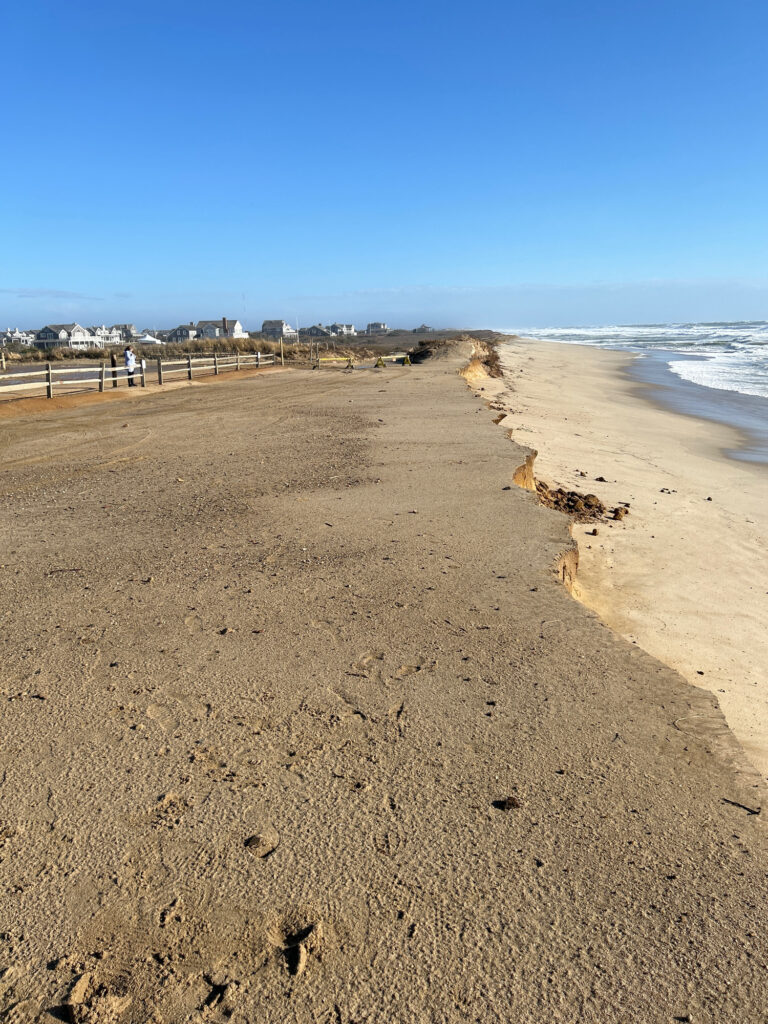 a sandy beach with people walking on it (MyCoast AI)