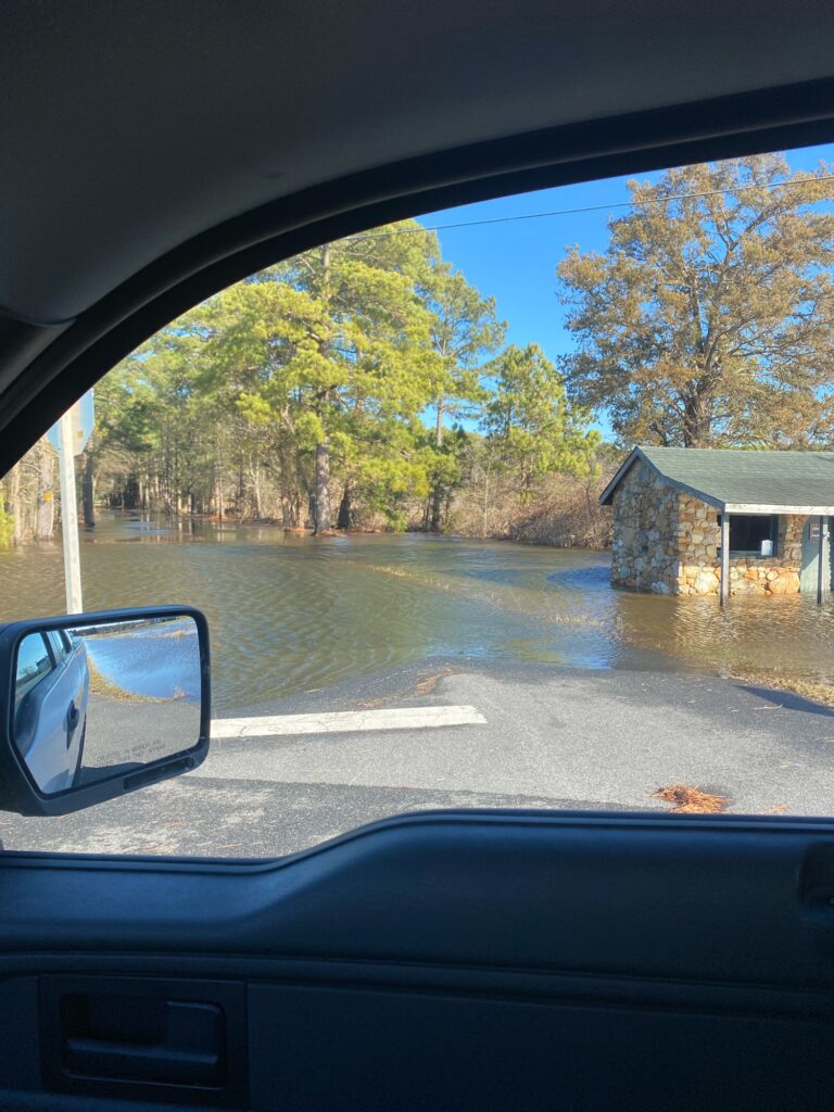 a car driving through a flooded road (MyCoast AI)