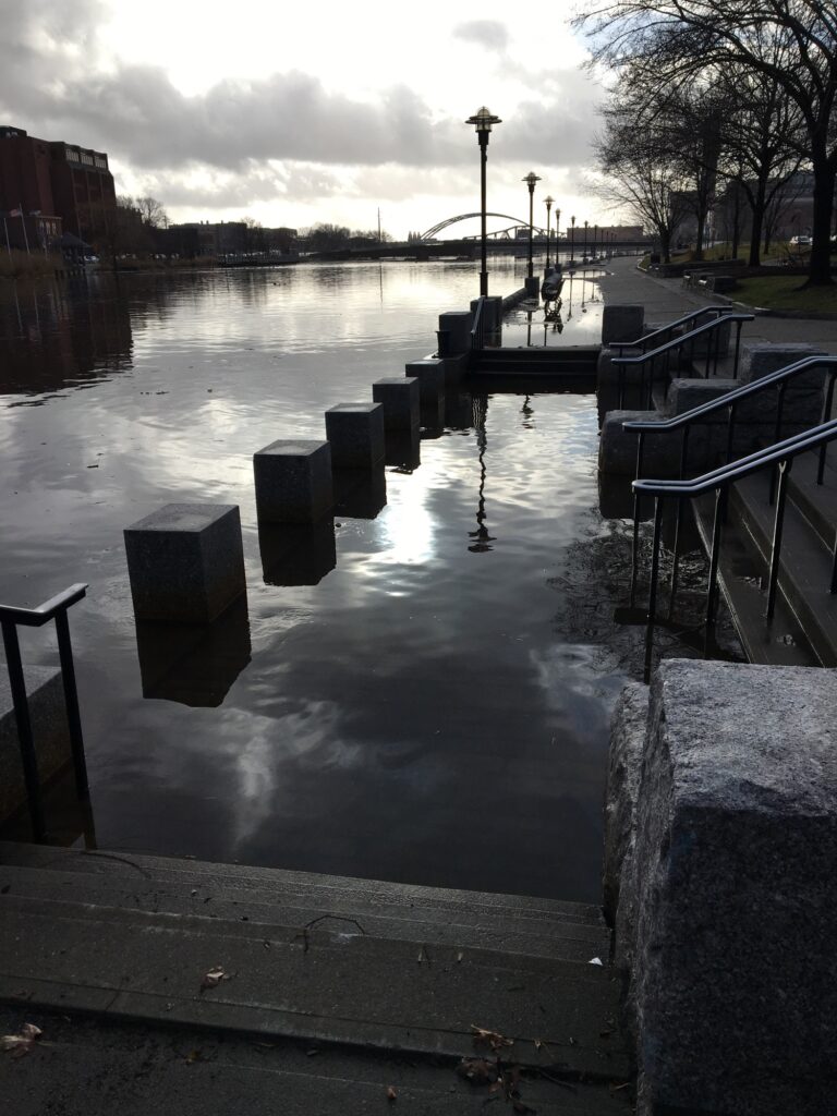 a body of water with benches and a sidewalk (MyCoast AI)