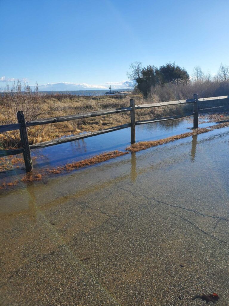 a fenced off area with a body of water in the background (MyCoast AI)