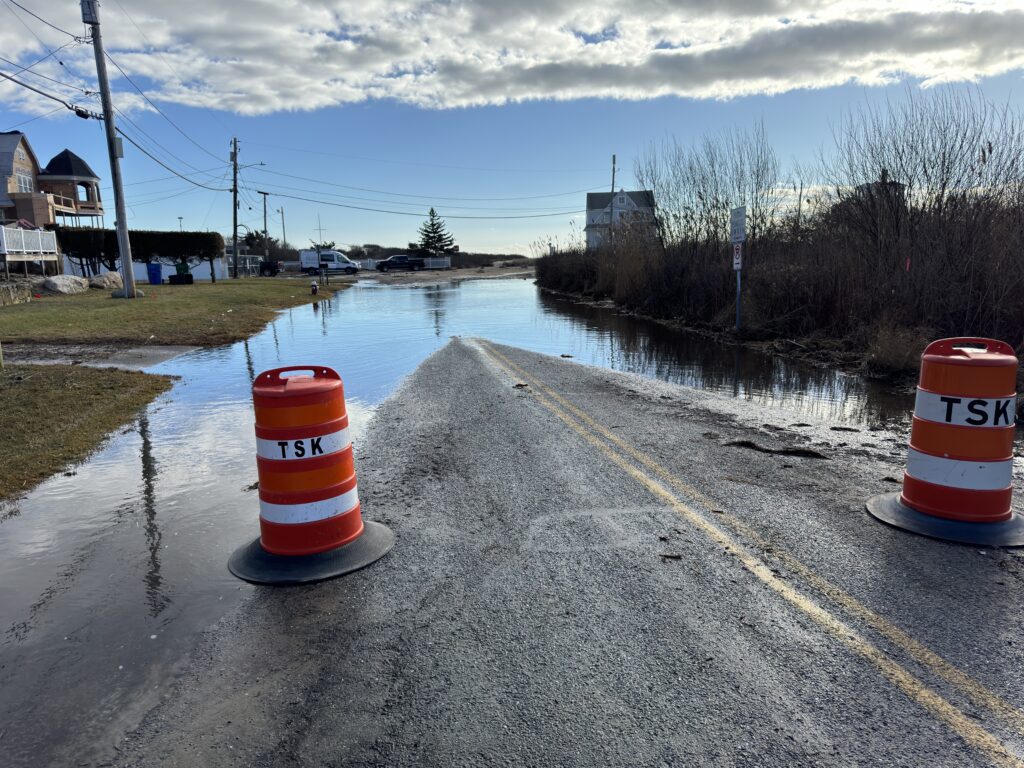 a flooded road with traffic cones (MyCoast AI)