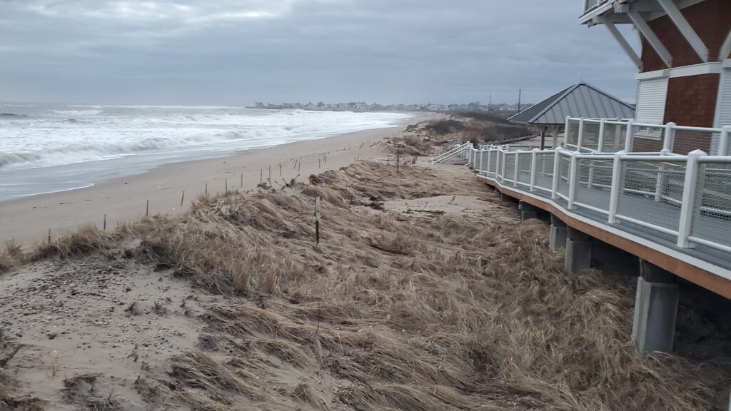 a beach with sand and a building (MyCoast AI)