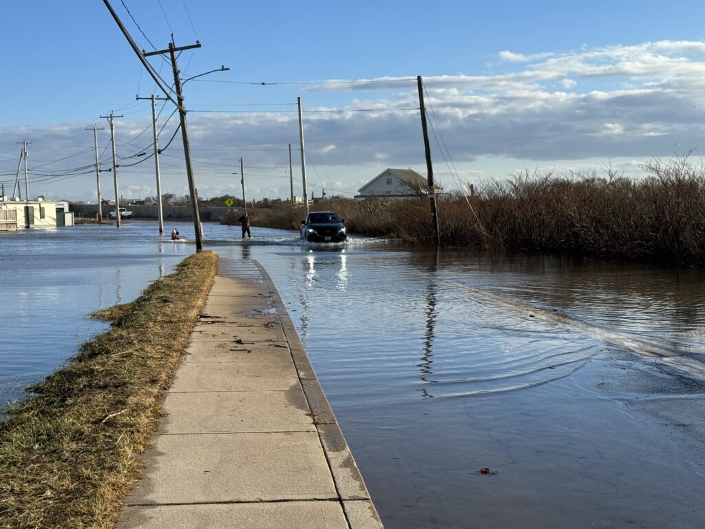 a car driving on a flooded road (MyCoast AI)