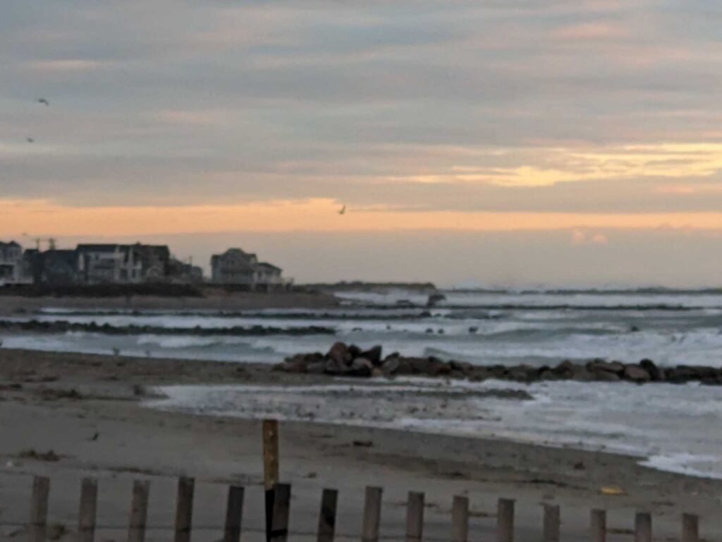 a beach with waves crashing (MyCoast AI)