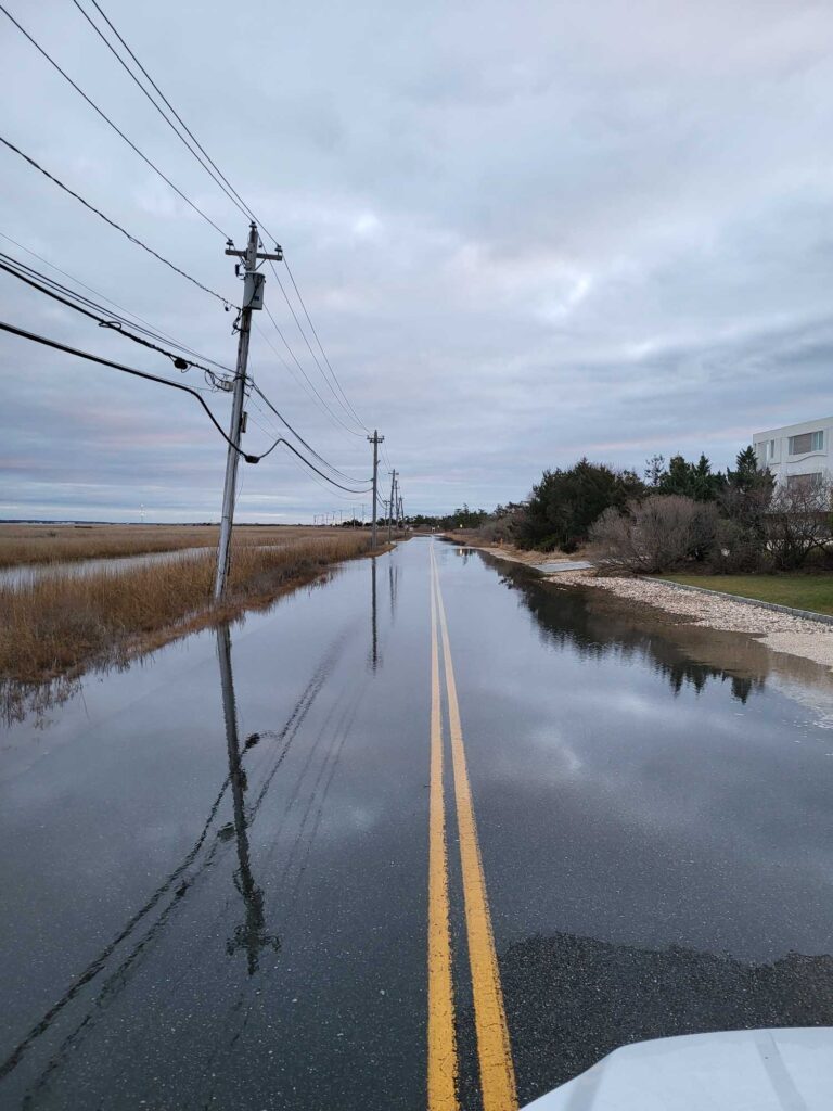 a flooded road with power lines (MyCoast AI)