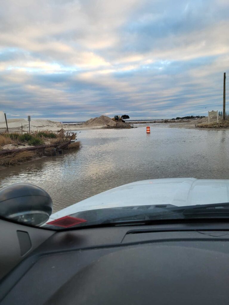 a car driving on a flooded road (MyCoast AI)