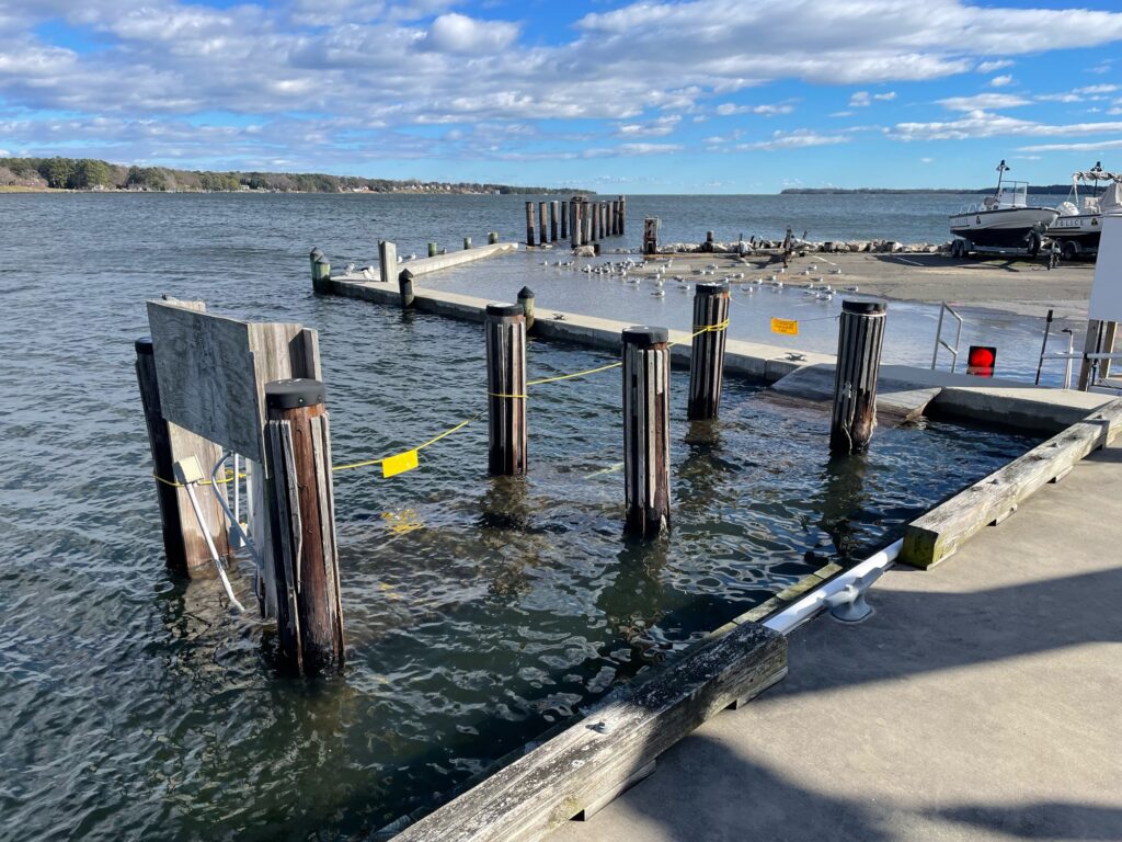 a dock with a boat in the water (MyCoast AI)