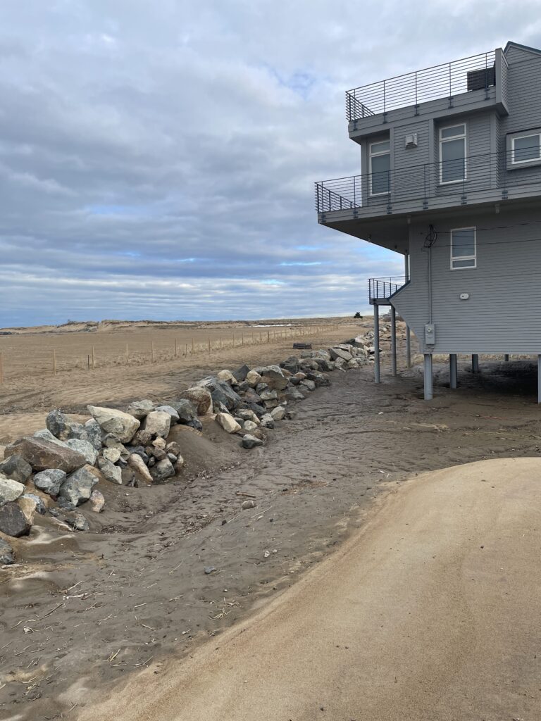 a building next to a beach (MyCoast AI)
