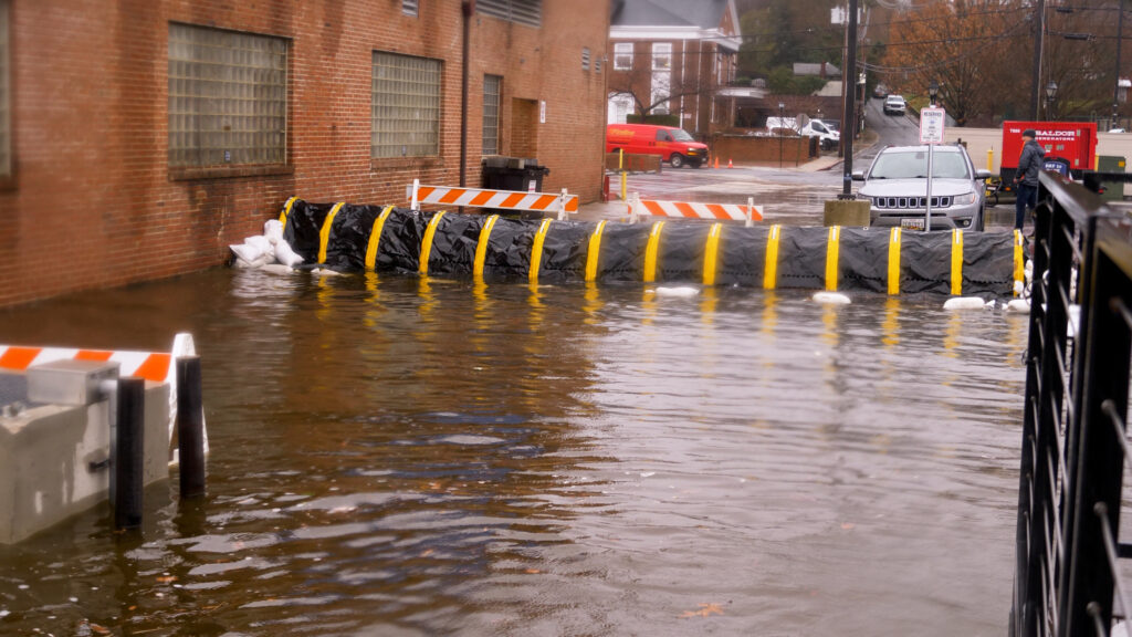 a flooded street with a car and a truck (MyCoast AI)