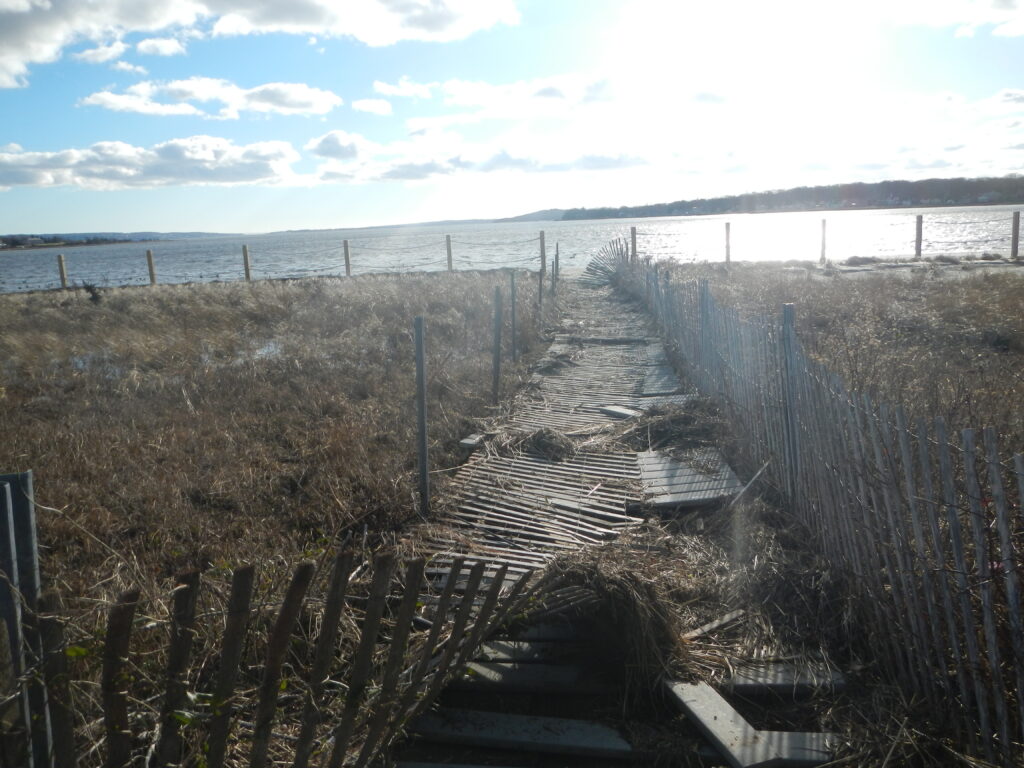 a fenced off area with a body of water in the background (MyCoast AI)