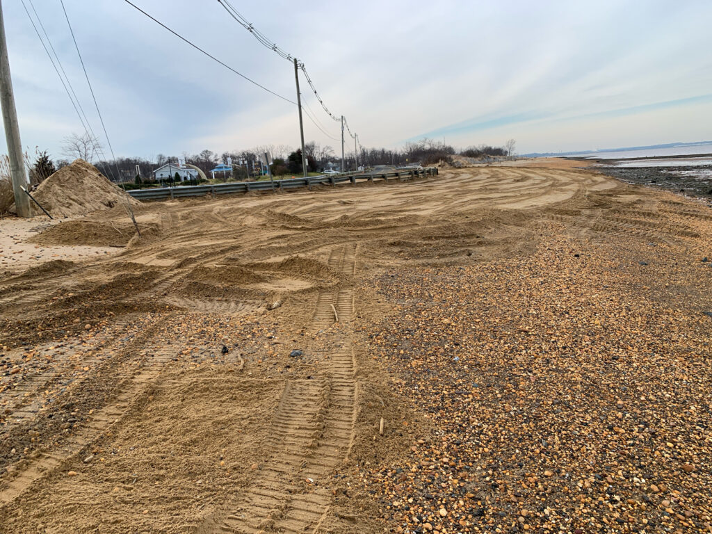 a dirt road with a pile of dirt on the side (MyCoast AI)