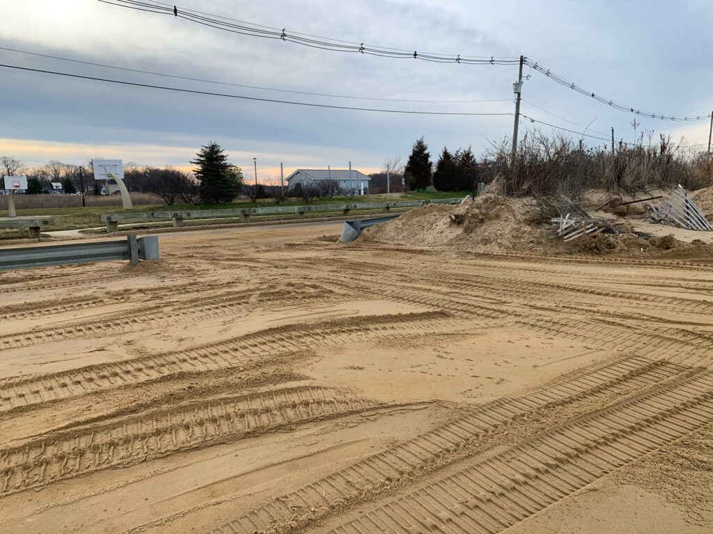 a dirt road with a pile of dirt on the side (MyCoast AI)