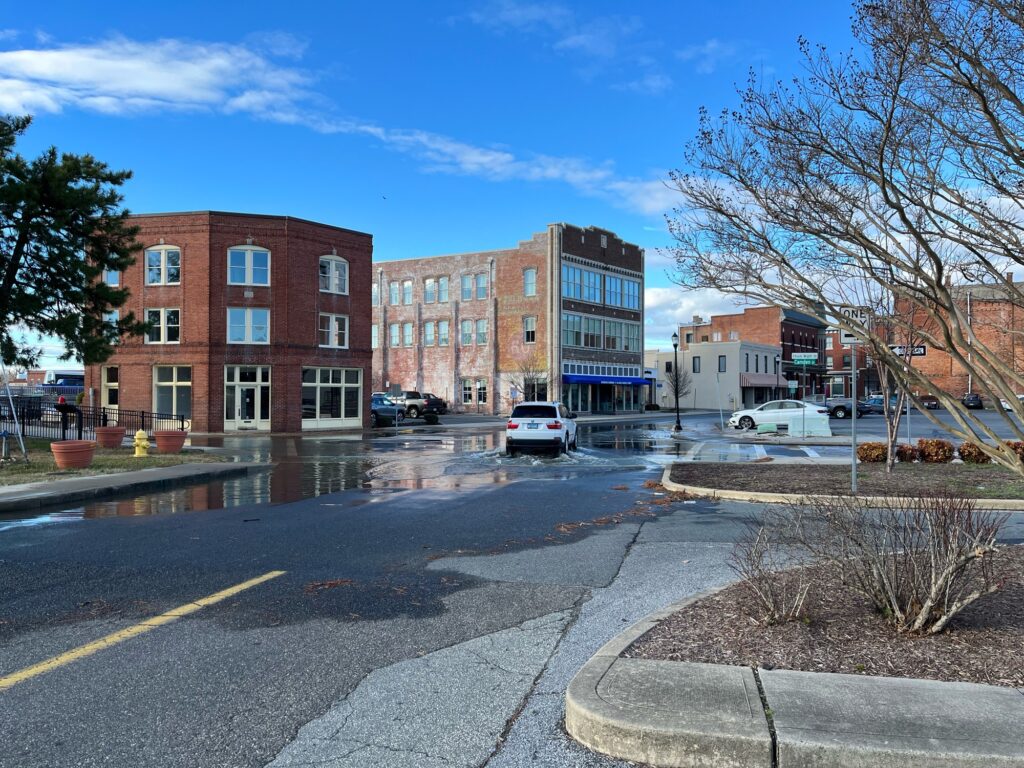 a street with cars and buildings on the side (MyCoast AI)
