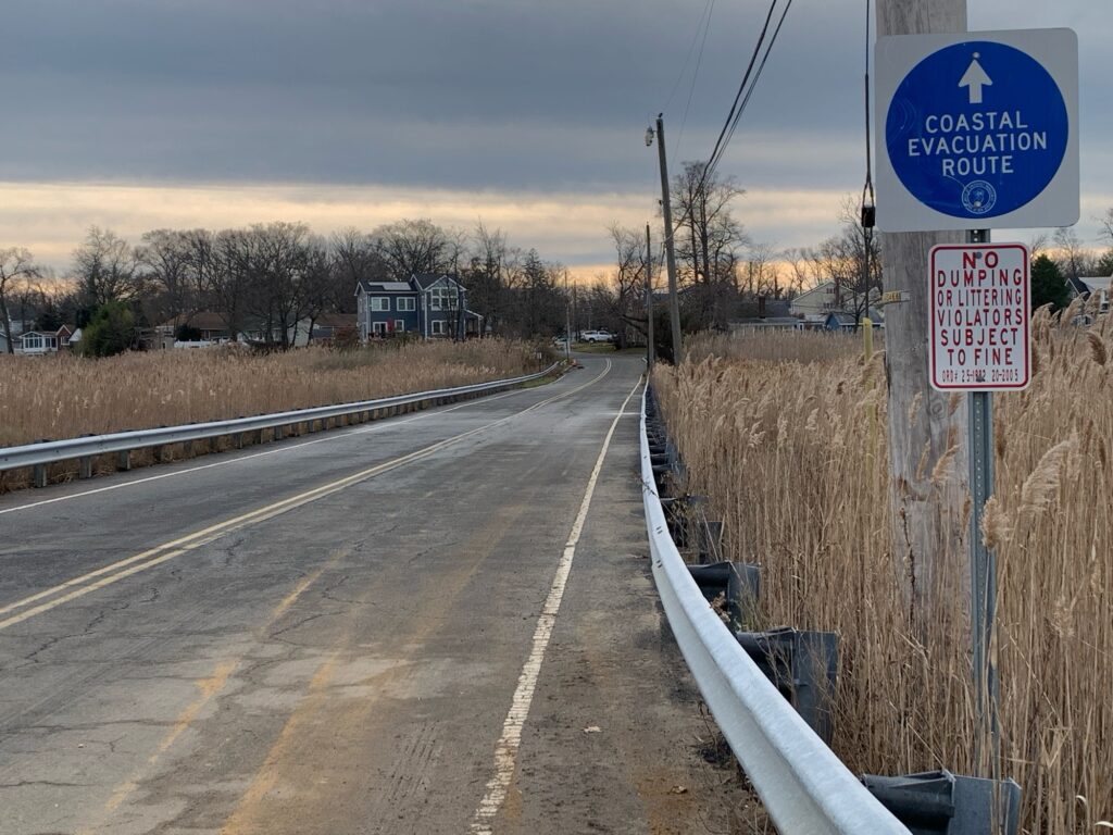 a road with a sign on it (MyCoast AI)
