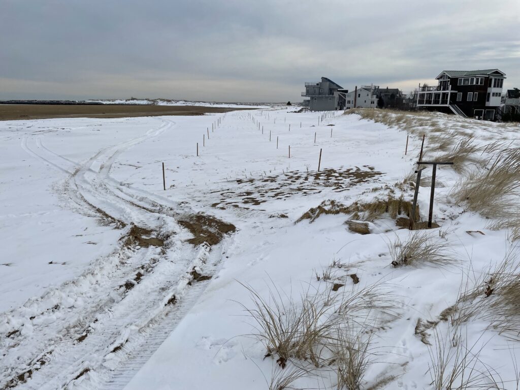 a snowy field with buildings in the background (MyCoast AI)