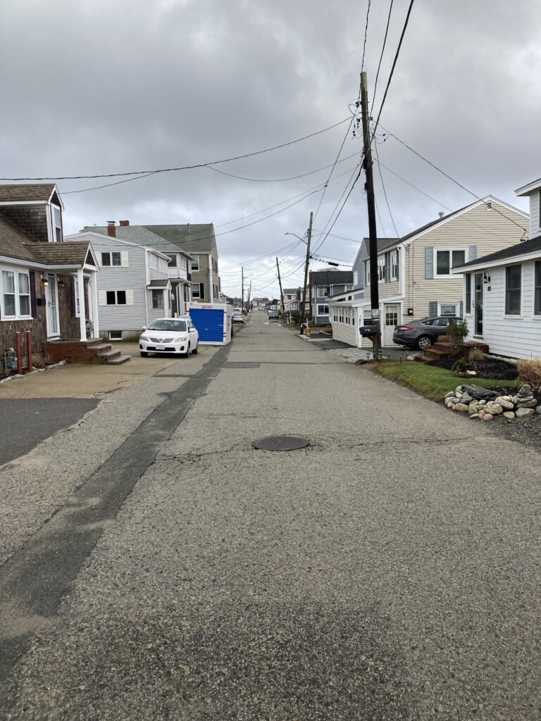 a street with houses and cars (MyCoast AI)