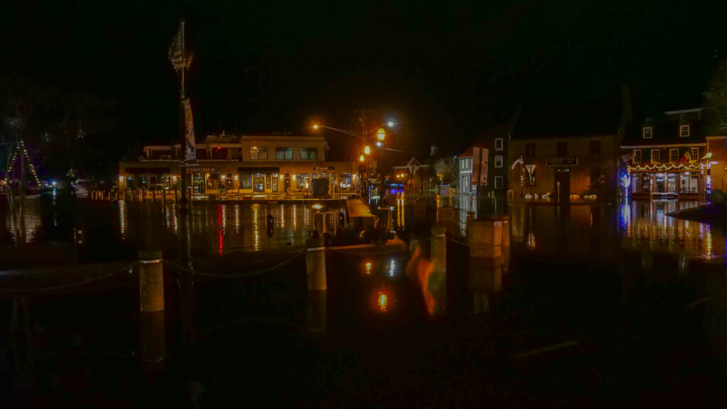 a body of water with buildings along it at night (MyCoast AI)