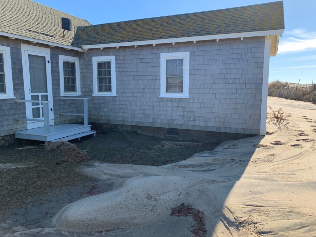 a house with a dirt yard (MyCoast AI)