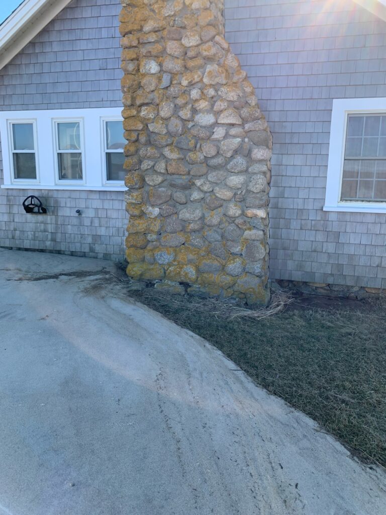 a stone wall with a hole in it (MyCoast AI)