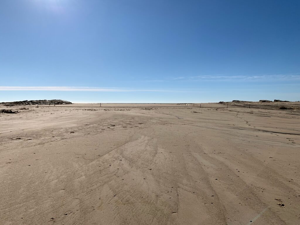 a sandy area with blue sky (MyCoast AI)