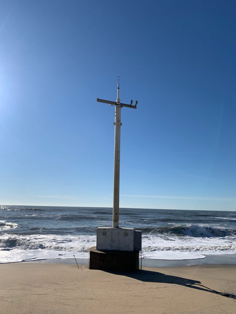 a cross on a beach (MyCoast AI)