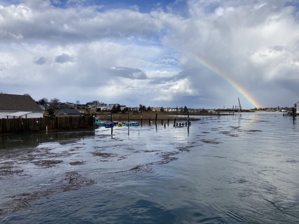 a rainbow over a body of water (MyCoast AI)