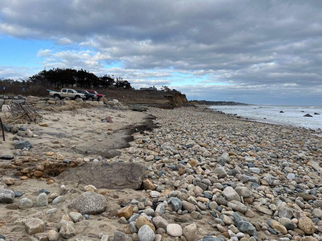 a rocky beach with cars parked on the side (MyCoast AI)