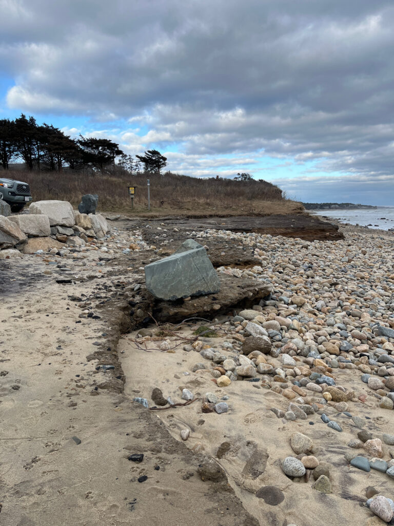 a rocky beach with a car parked on the side (MyCoast AI)