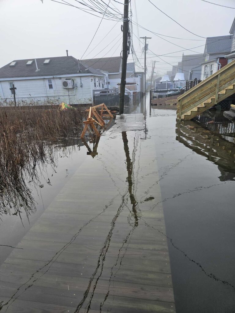 a flooded street with houses (MyCoast AI)