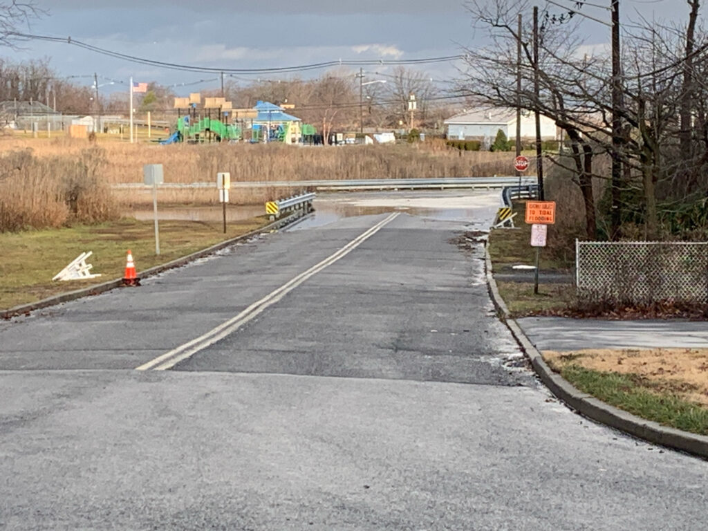 a road with a cone on the side (MyCoast AI)