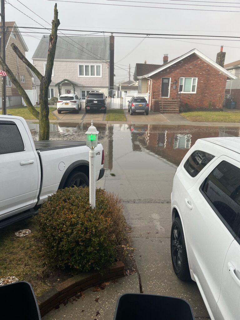 a flooded street with cars (MyCoast AI)