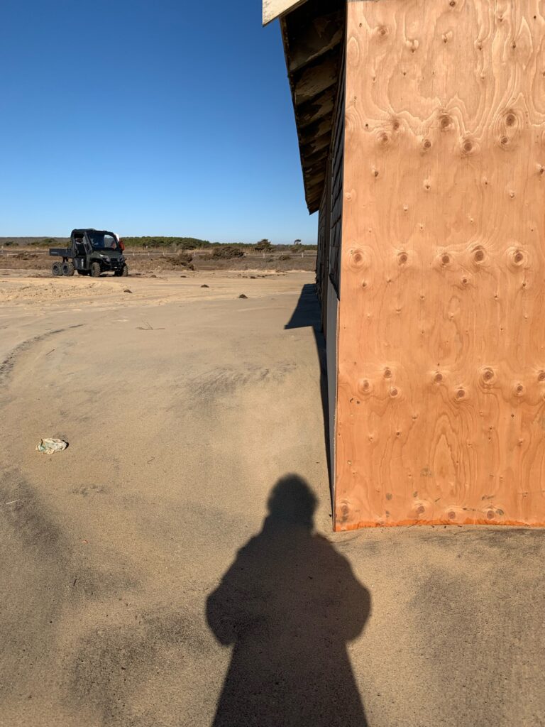 a person's shadow on a concrete surface (MyCoast AI)