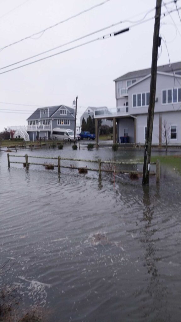 a flooded street with houses (MyCoast AI)