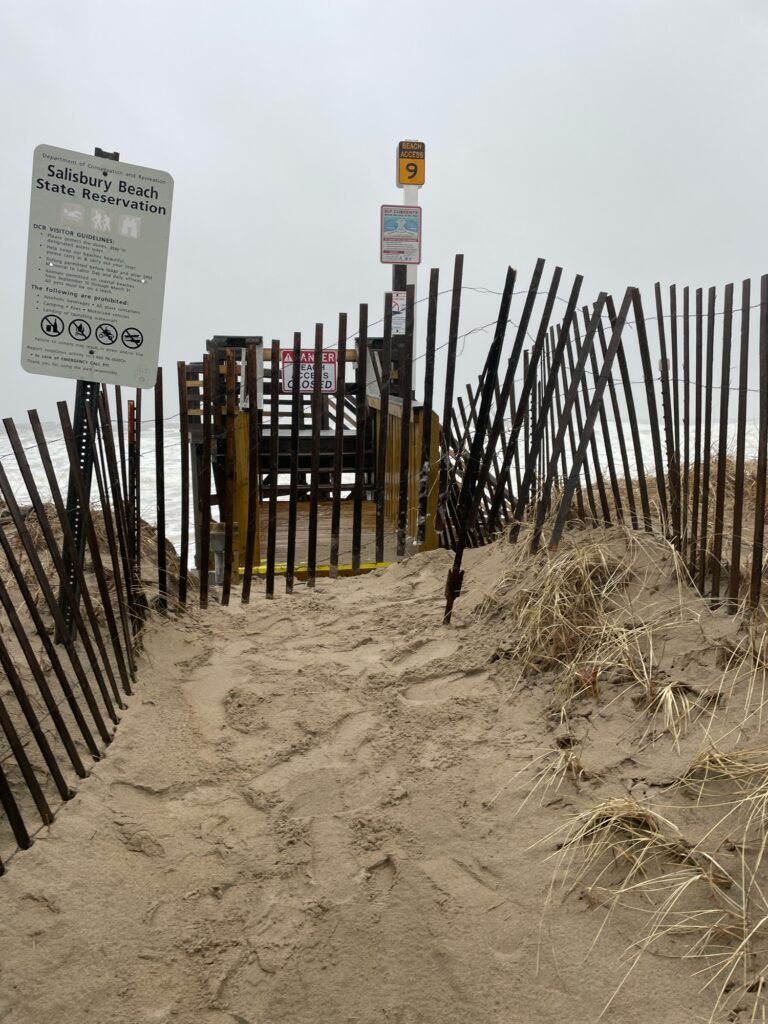 a fenced off area with signs (MyCoast AI)