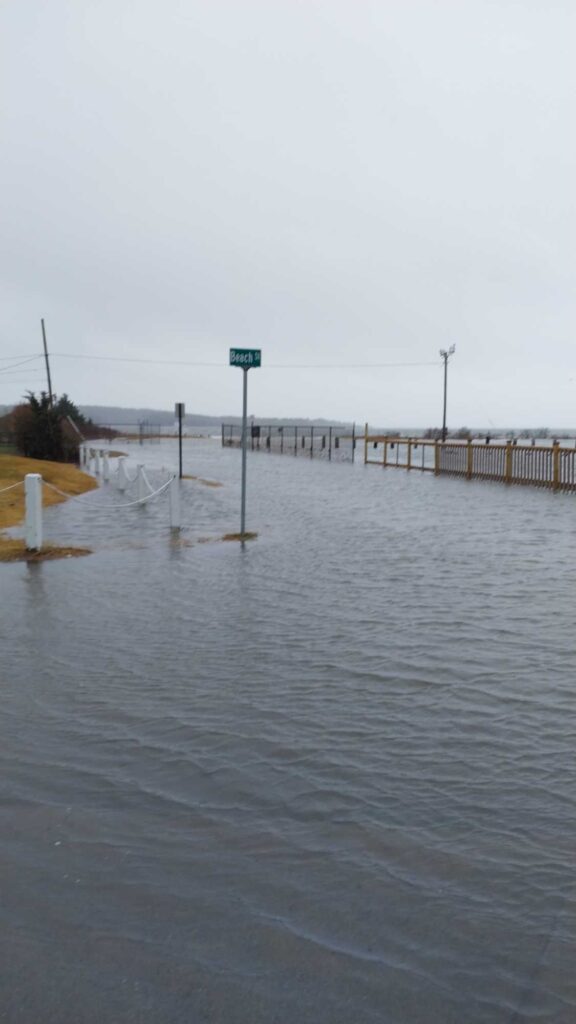 a flooded road with a sign (MyCoast AI)