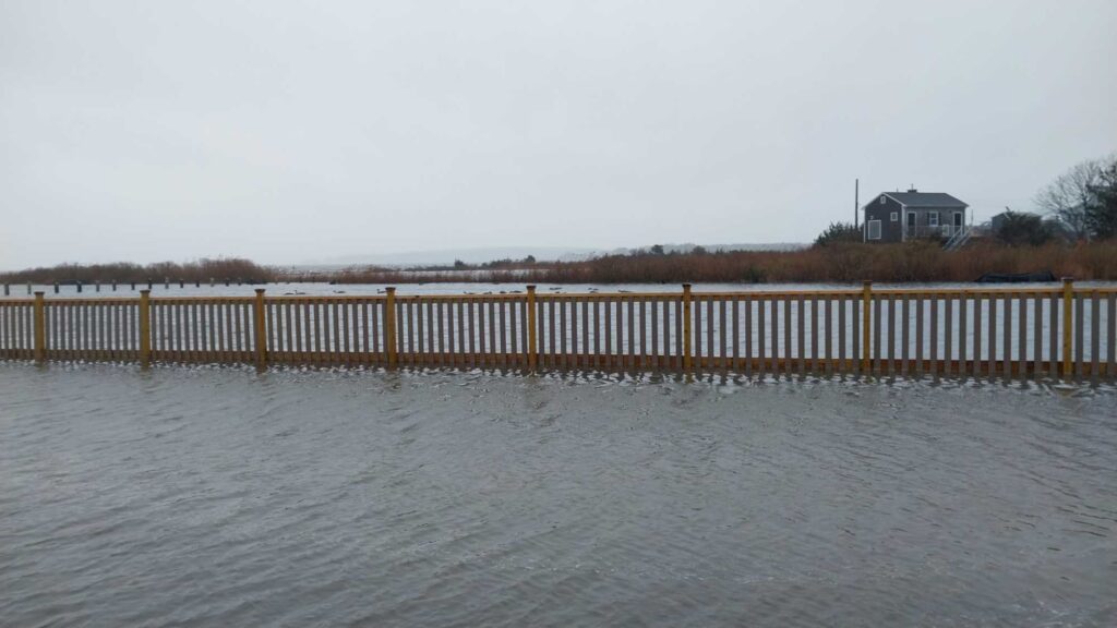 a wooden fence in a lake (MyCoast AI)