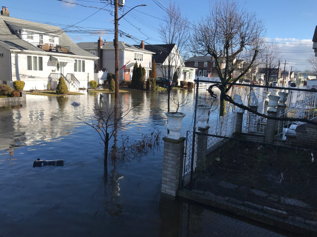 a flooded street with houses (MyCoast AI)